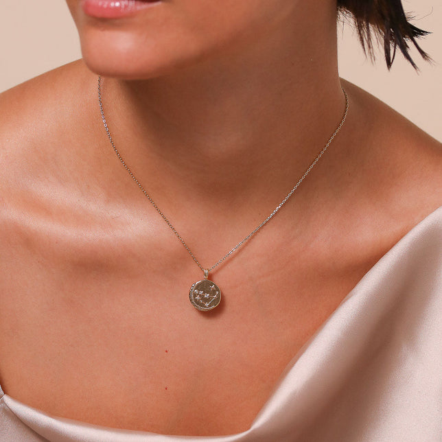 Capricorn Zodiac Pendant Necklace in Gold worn