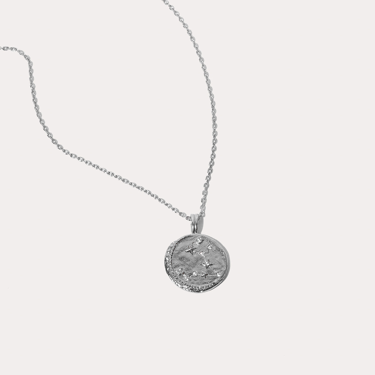 Close up shot of the front of the Pisces Zodiac Pendant Necklace in Silver